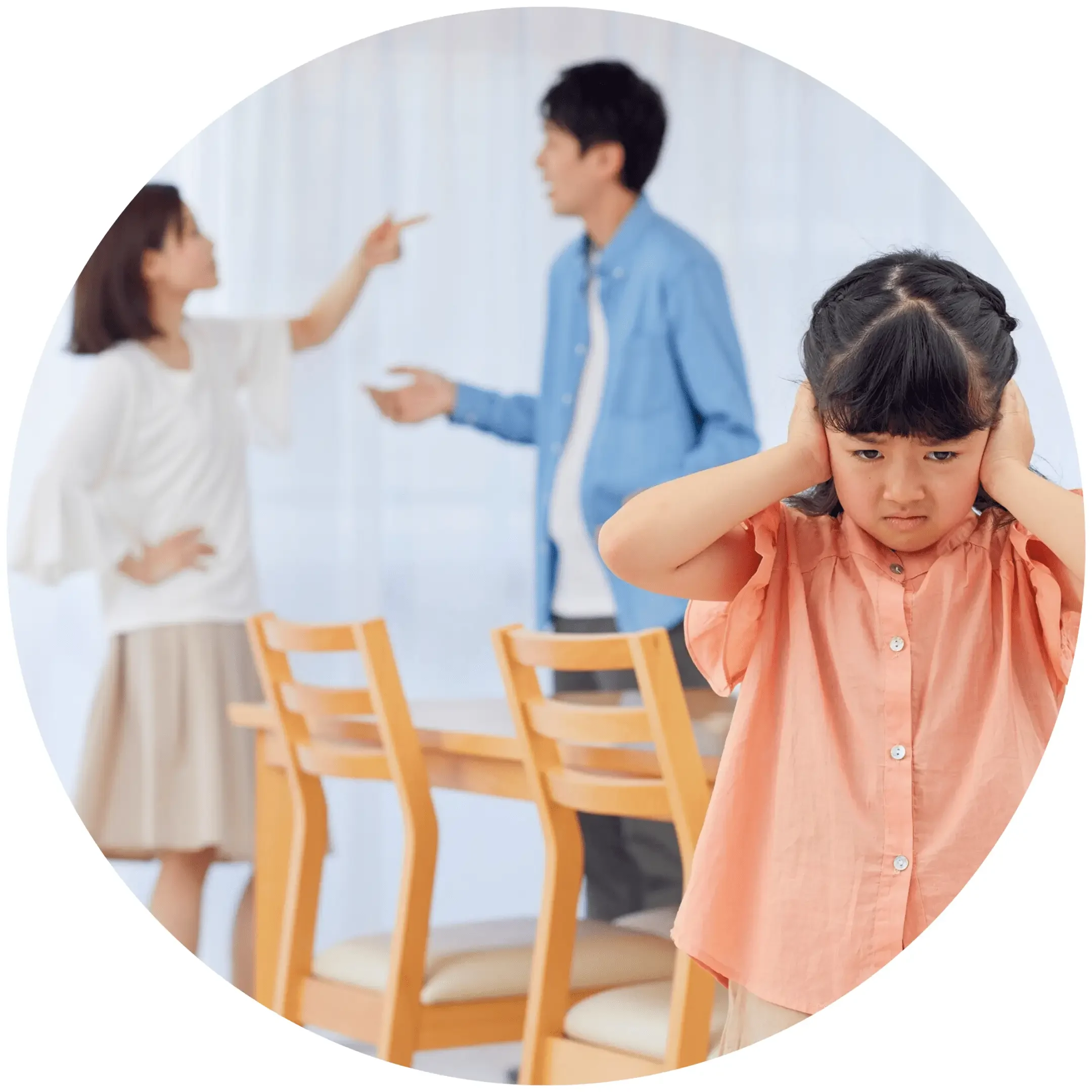 A group of people standing around a table.